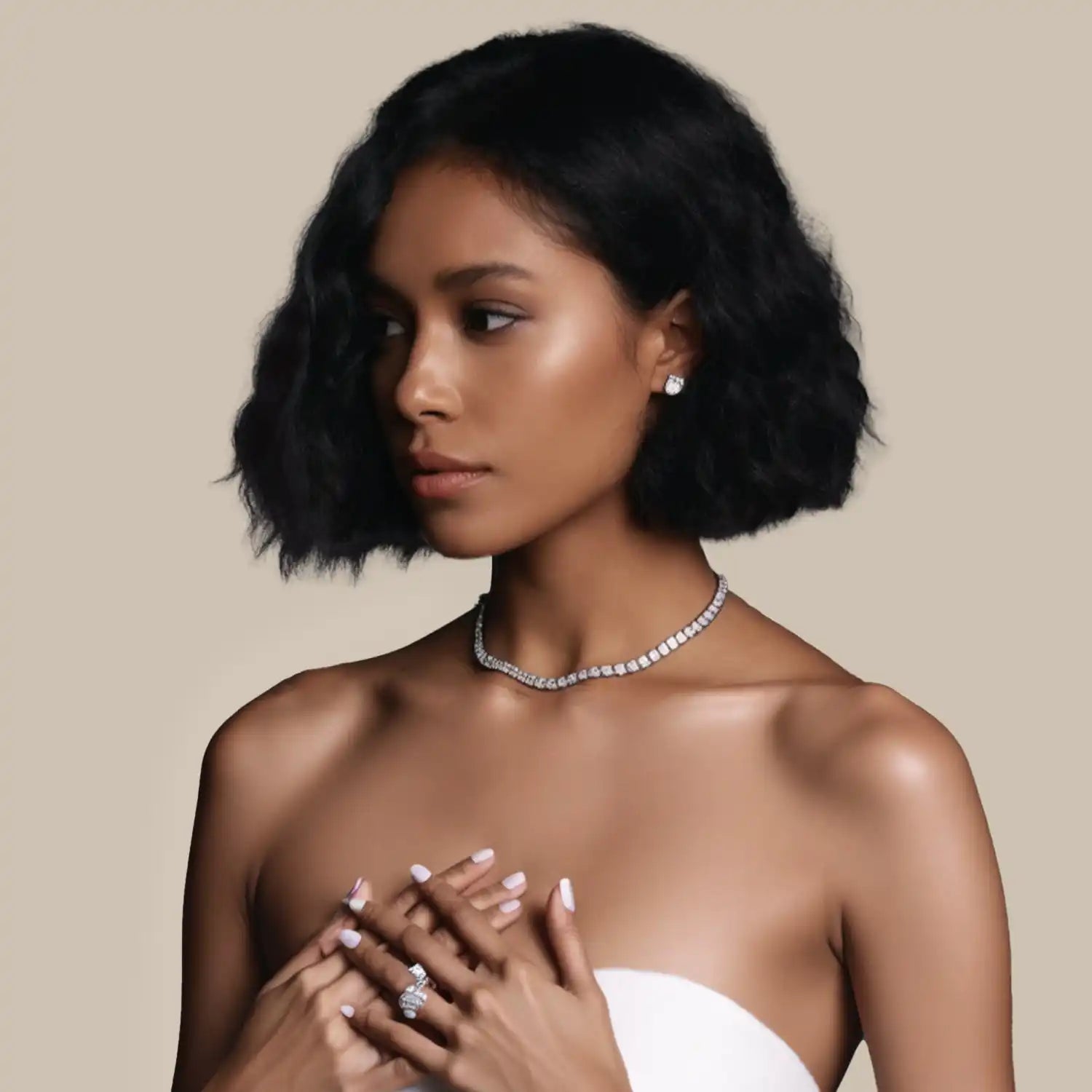 Woman wearing diamond jewelry.
