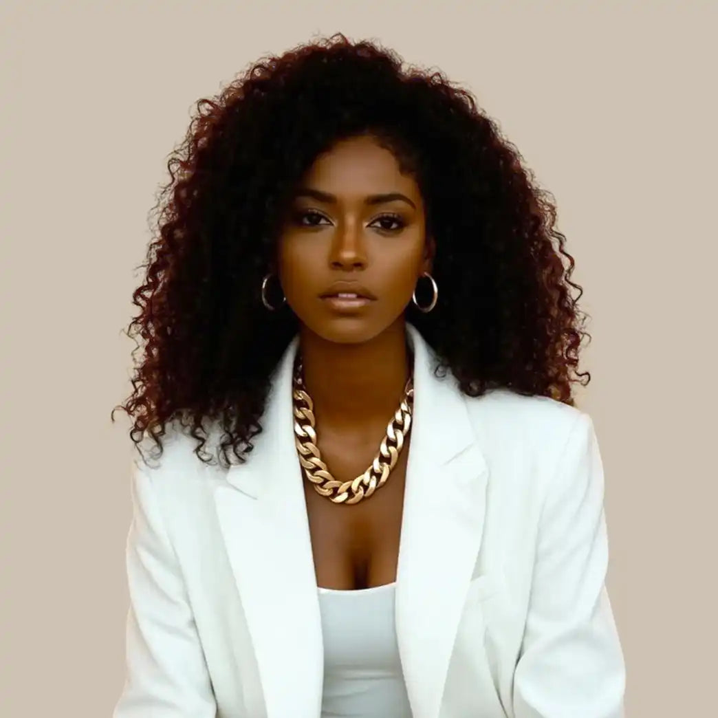Woman wearing a gold chain necklace.