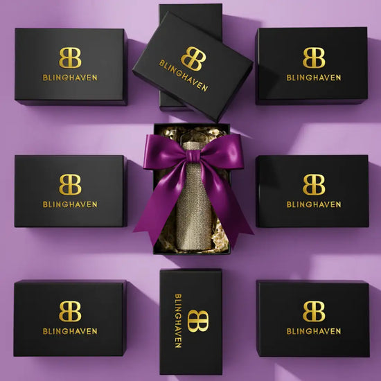Black and gold blinghaven jewelry box set with purple ribbon bow.