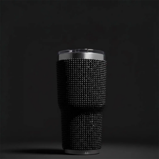 Black rhinestone-encrusted insulated tumbler with a silver lid and base.