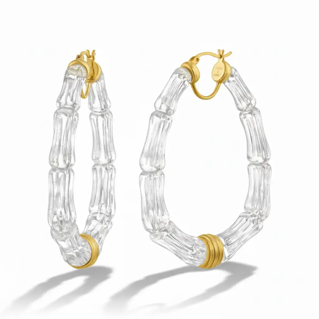 Clear glass bamboo hoop earrings with gold-tone hardware.