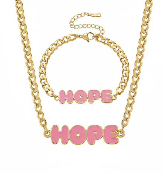 A gold chain necklace and bracelet set, both featuring a pink ’HOPE’ pendant.