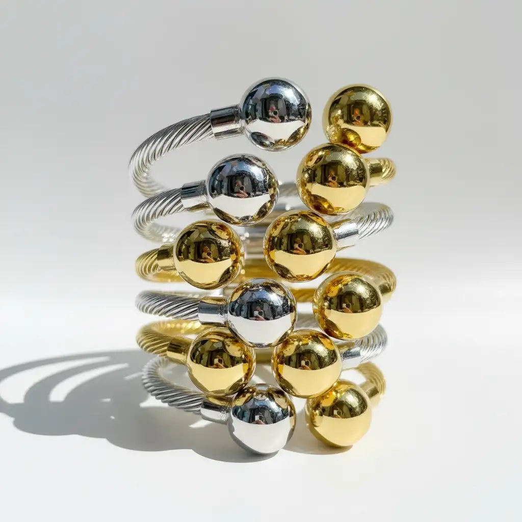 Gold and silver beaded bracelet stack.