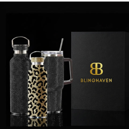 Leopard-print water bottle with black and gold pattern, covered in sparkling rhinestones.