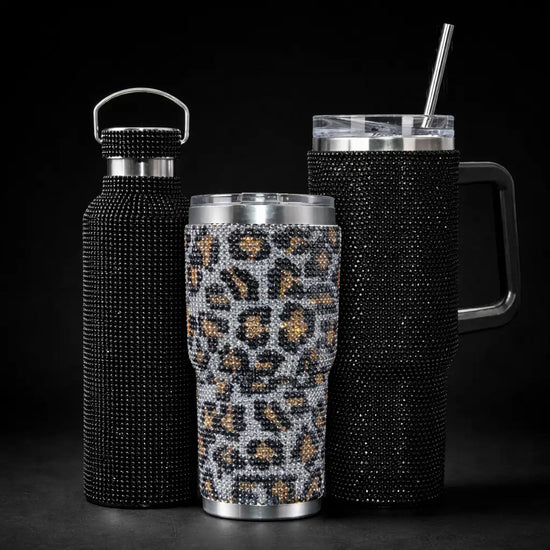 Leopard-printed tumbler with black and gold rhinestone detailing.
