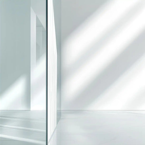 A minimalist empty room with sunlit walls and floor.