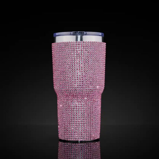 Pink rhinestone tumbler cup with stainless steel interior and lid.