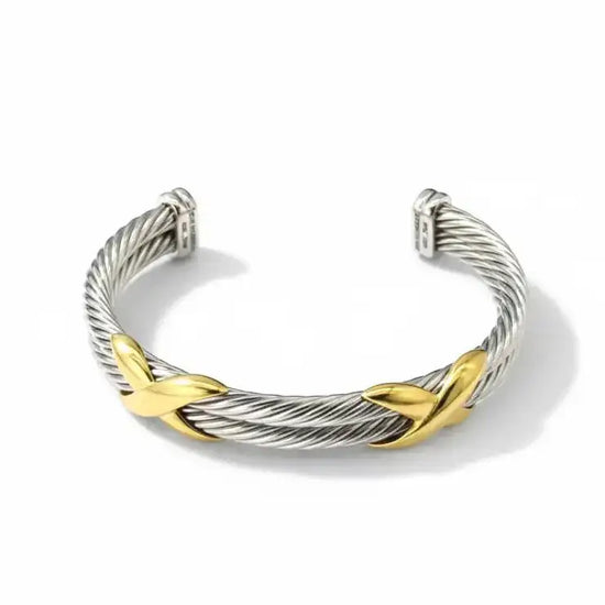 Silver and gold two-tone cable bracelet with leaf-shaped accents.